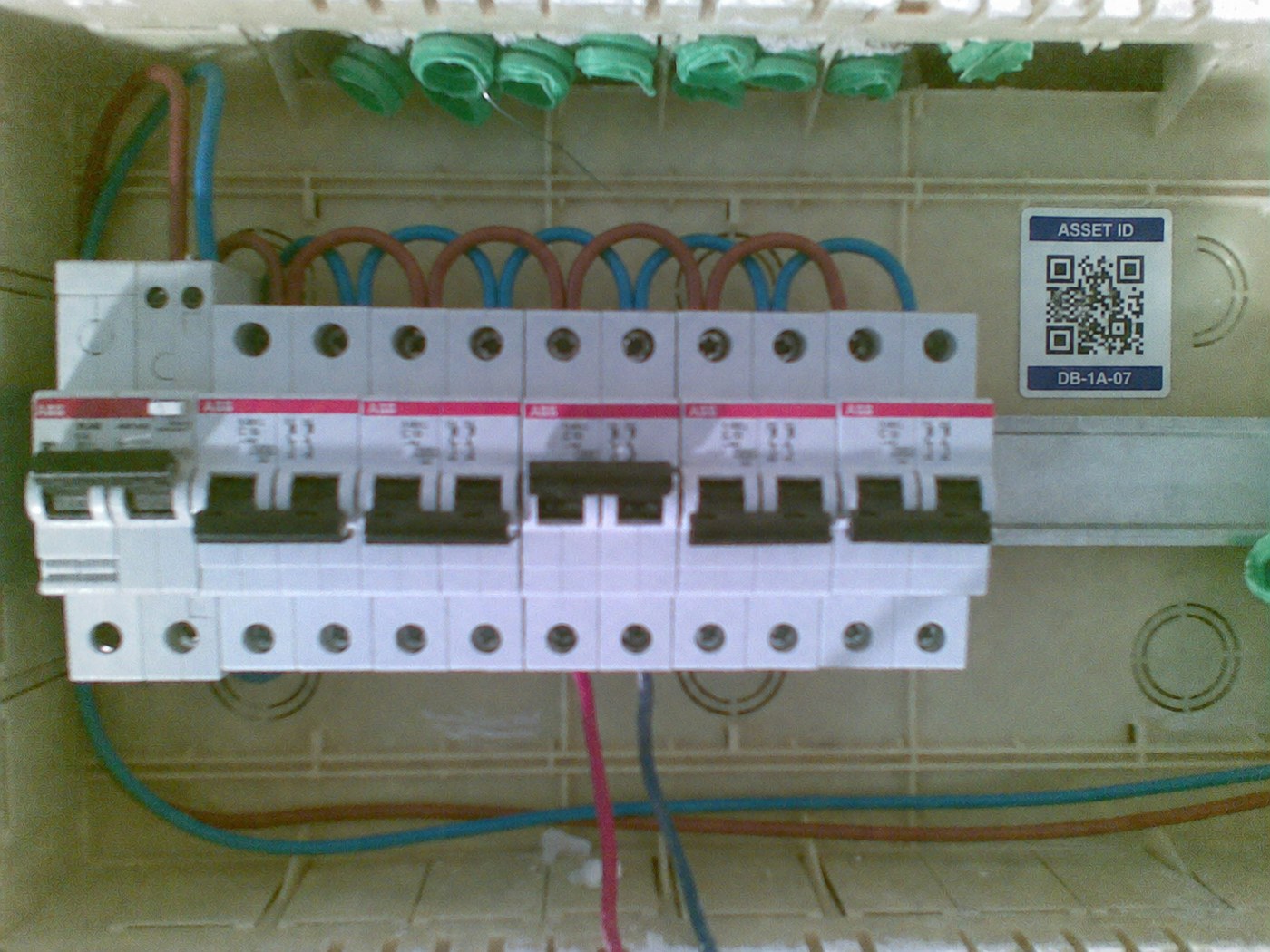 Electrical distribution asset with an attached QR identification tag